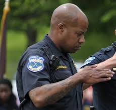 An American police officer paying homage to Allah