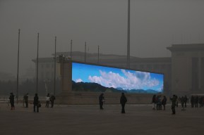 BEIJING, CHINA - The LED screen shows the blue sky on the Tiananmen Square at dangerous levels of air pollution on January 23, 2013 in Beijing, China. (Photo by Feng Li/Getty Images)