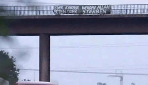 Demonstrating their gratitude for sanctuary, the Muslims hung this banner that says, all your children will pray to Allah or die.