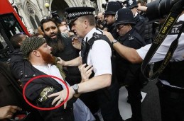 A young Brit who has joined the Mujahid in London, and wears an armband to signify which team he is on.